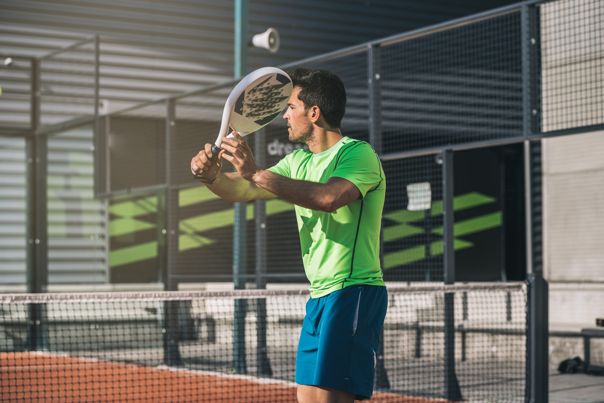 man playing padel scaled